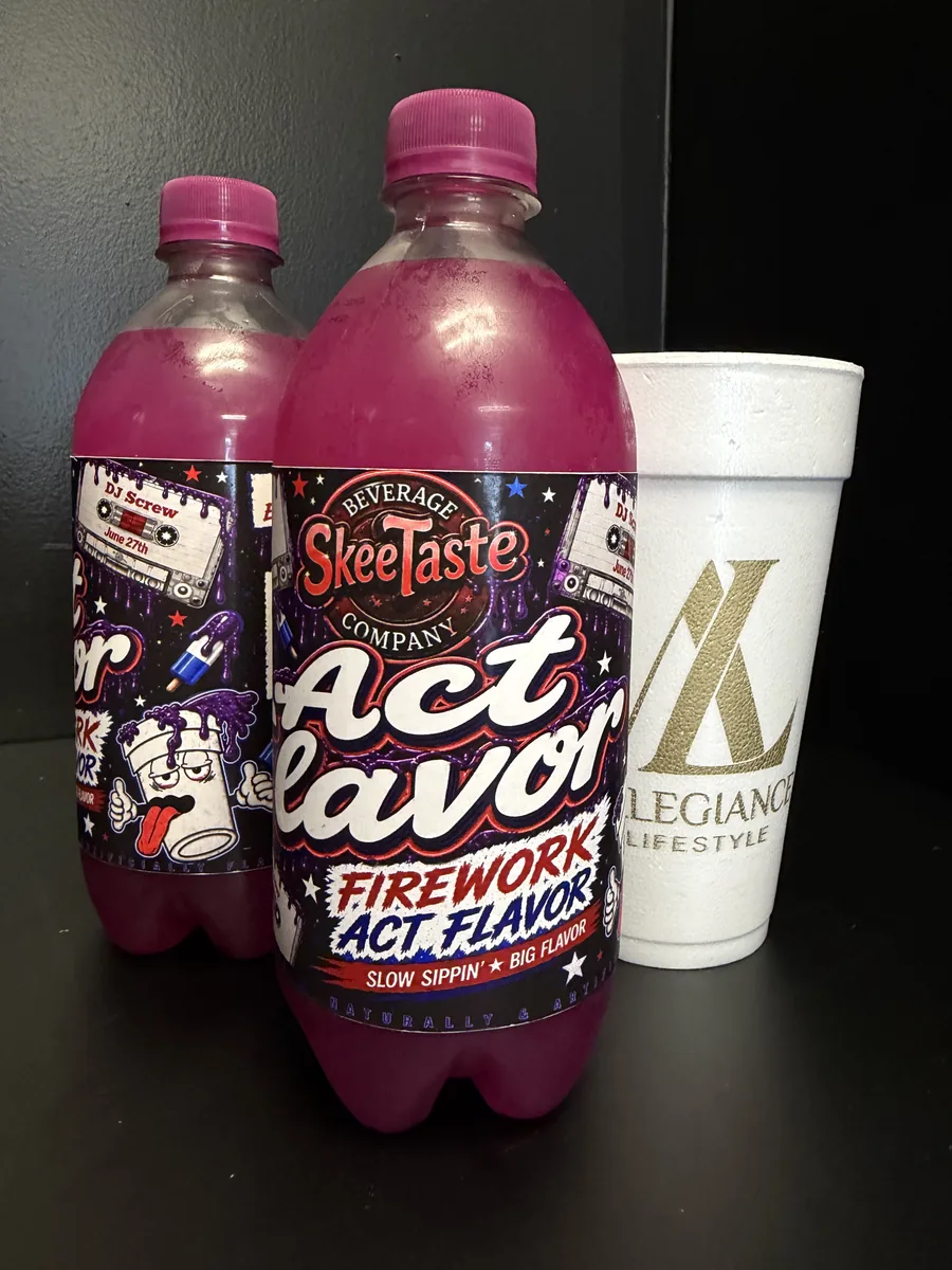SkeeTaste Firework ACT Flavor bottles beside an Allegiance Lifestyle cup