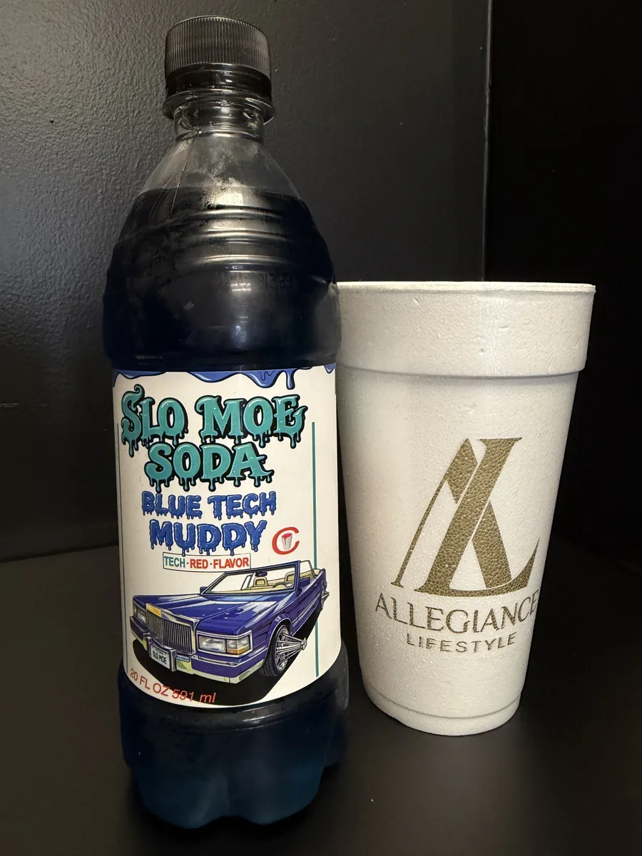 Blue Tech Muddy w/ Tech Red Flavor soda bottle by Slo Moe Soda