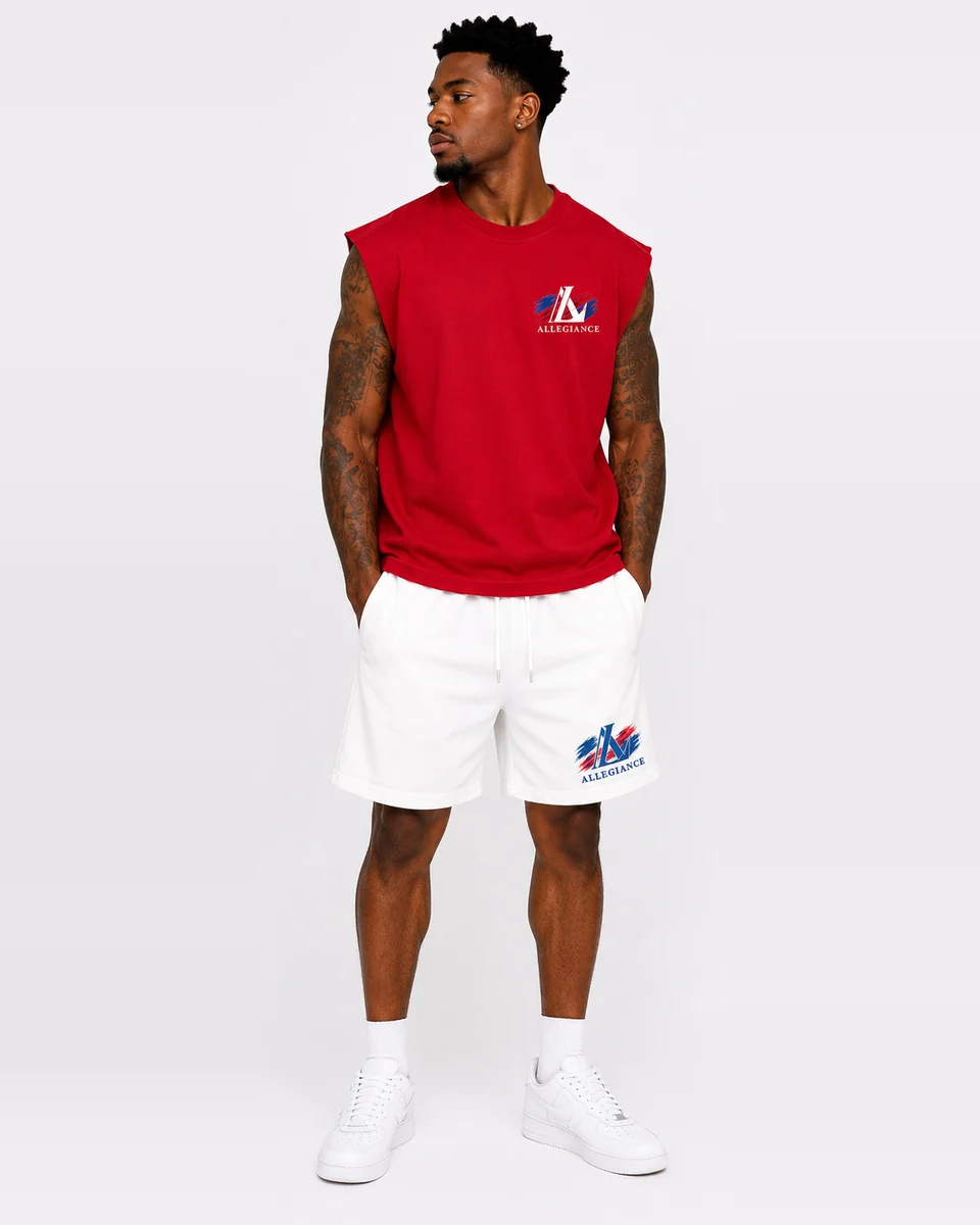 Red cut-off sleeveless shirt with white shorts by Allegiance Lifestyle