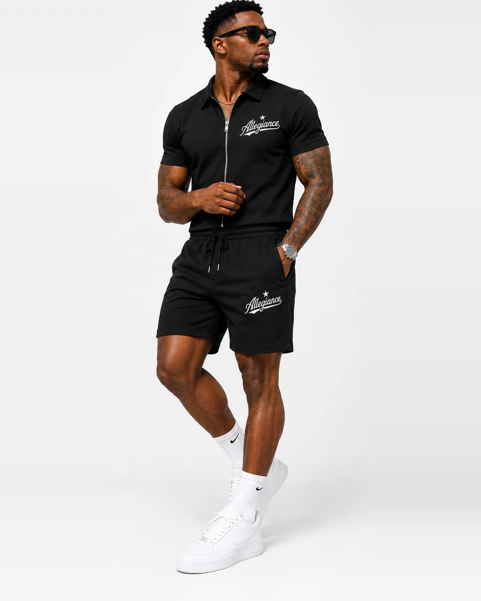 Allegiance Full Zip Set in black with Allegiance script on the shirt and shorts, worn front view
