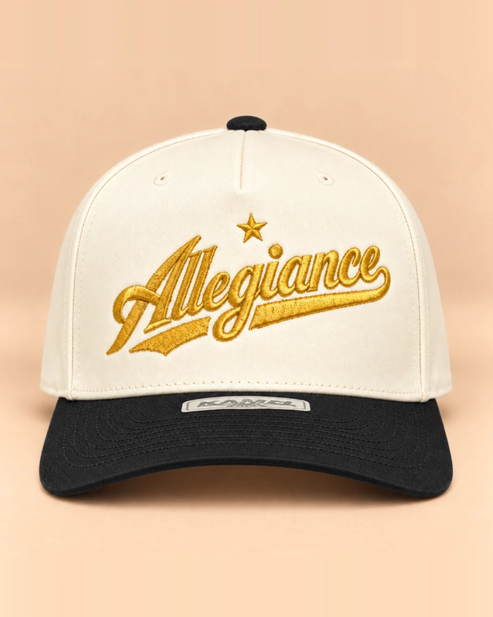 Cream snapback with black brim and gold Allegiance script embroidery by Allegiance Lifestyle