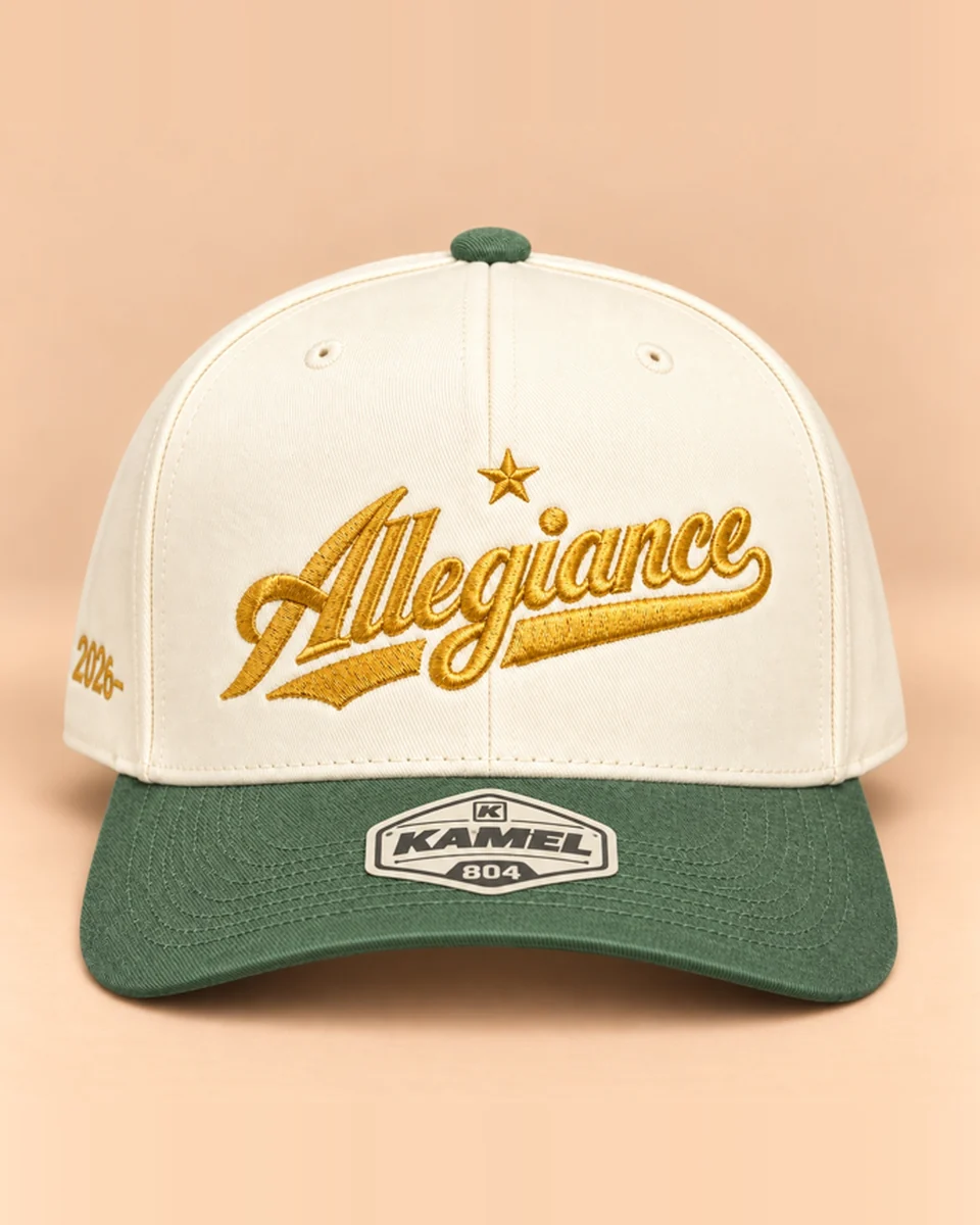 Cream snapback with green brim and gold Allegiance script embroidery by Allegiance Lifestyle