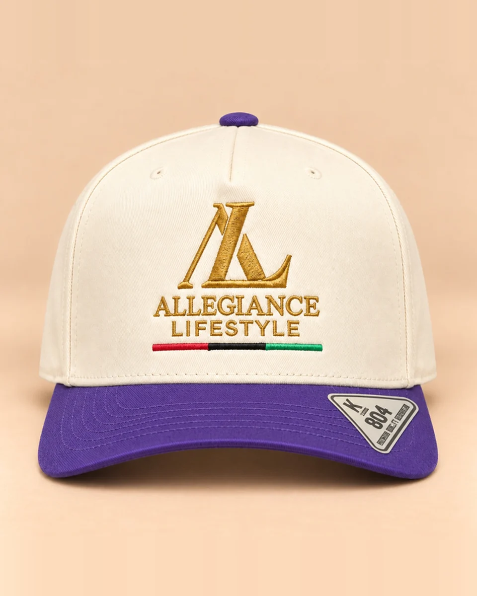 Cream snapback with purple brim and gold Allegiance Lifestyle logo by Allegiance Lifestyle