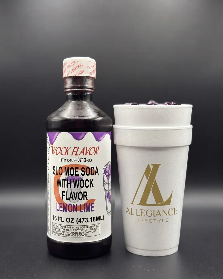 Slo Moe Lemon Lime Wock pint beside an Allegiance Lifestyle branded double cup with purple ice